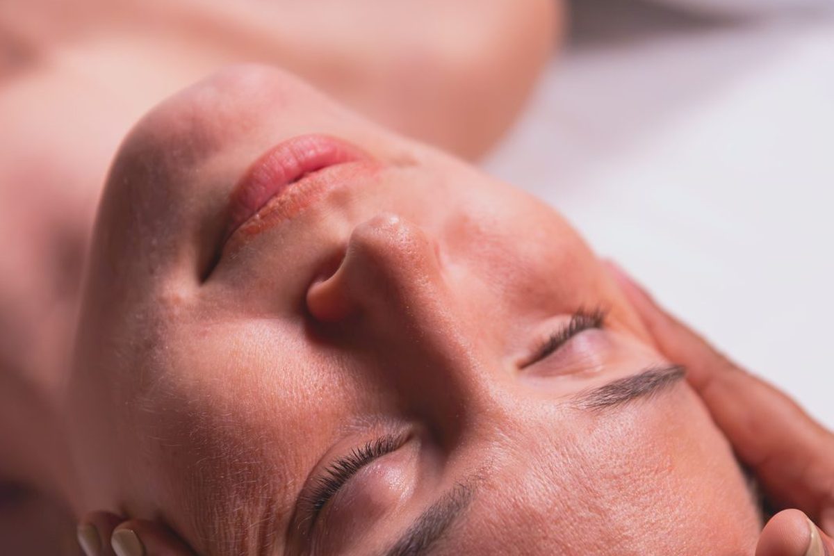 Scalp and temple massage during a head and scalp treatment at Healastic in Manotick